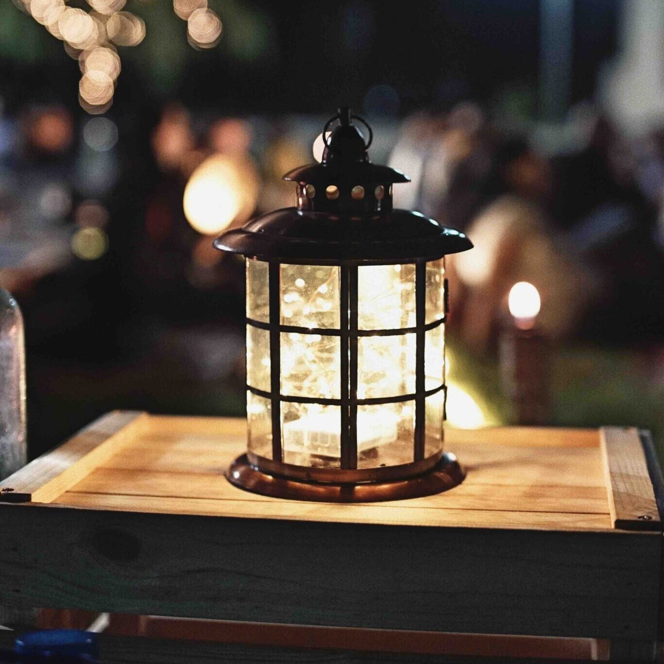 Lantern on a wooden chest, an evening